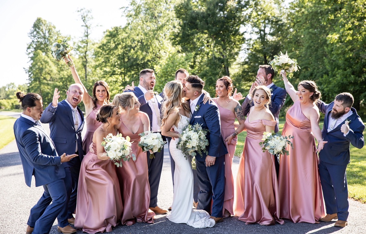 Courtney and Josh with loved ones on their wedding day